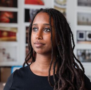 A person with long hair looking away