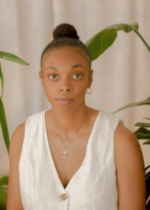 A close-up head-shot of Rhea Beckett